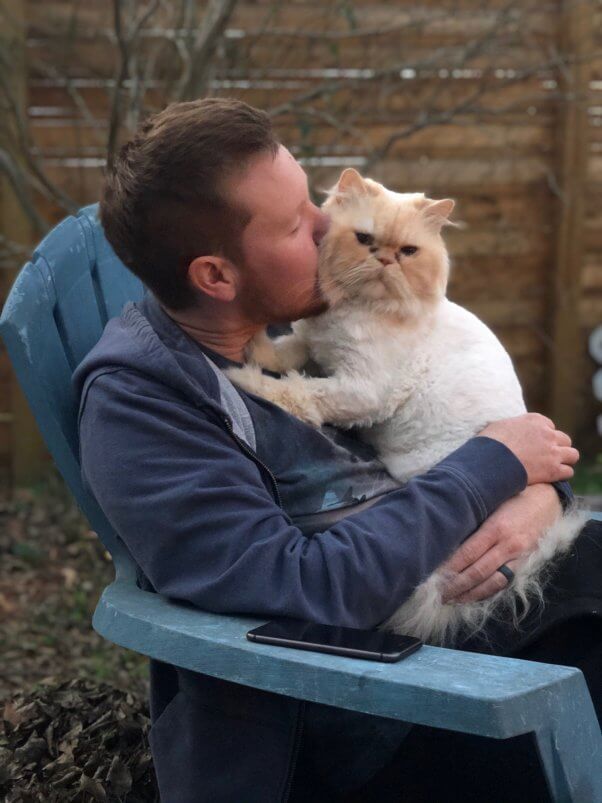 Marvin snuggling with human friend