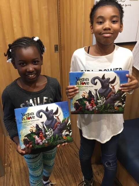 Kids Holding Books from PETA's Barks to Books Program