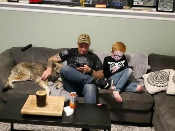 Wolfie relaxing with her new family