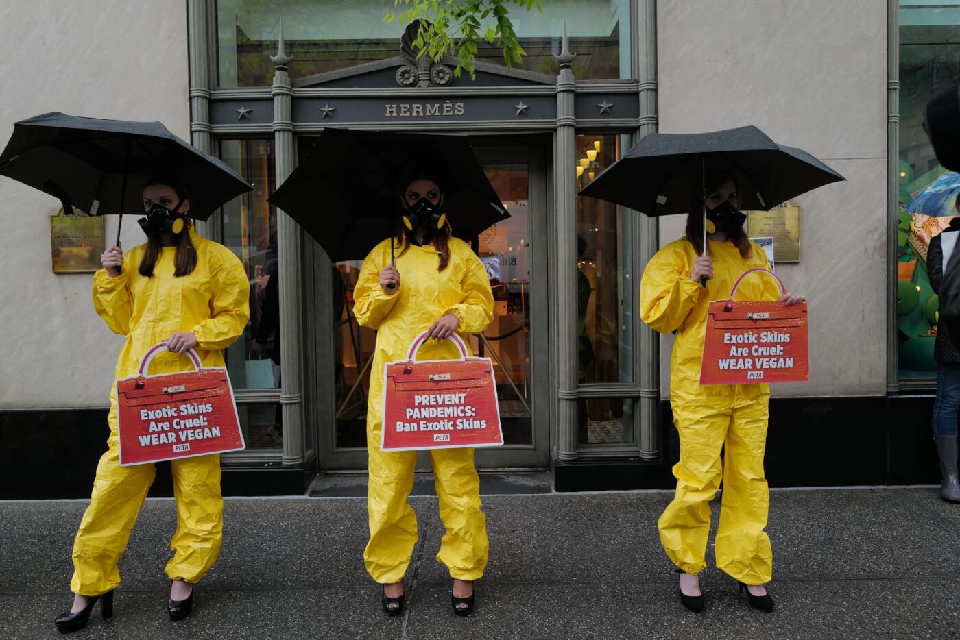 Hazmat suits and high heels PETA protest outside Hermes NYC