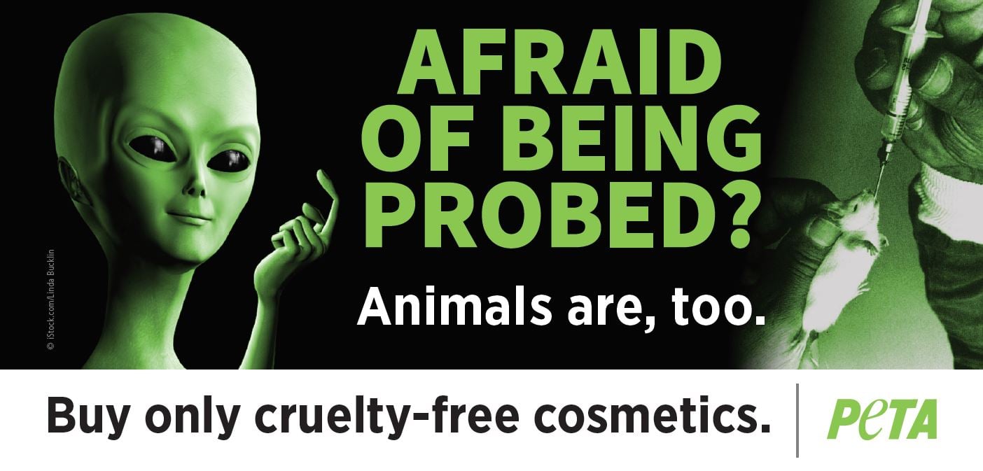 PETA ad with alien holding up a finger and the text "AFRAID OF BEING PROBED? Animals are, too. Buy only cruelty-free cosmetics."