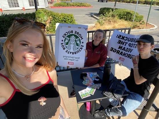 3 students pose outside of Starbucks