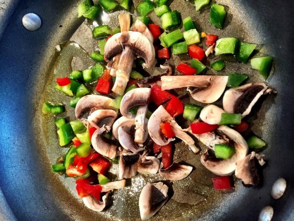 Shiitake mushrooms and peppers are sautÃ©ed