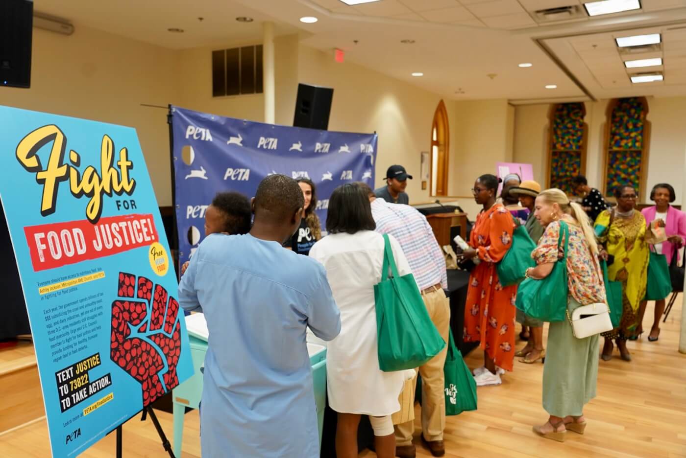 handing out vegan meals at a food justice event in Washington, D.C.