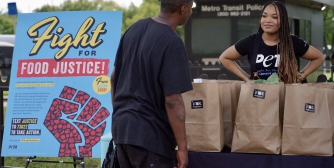 handing out vegan meals at a food justice event in Washington, D.C.
