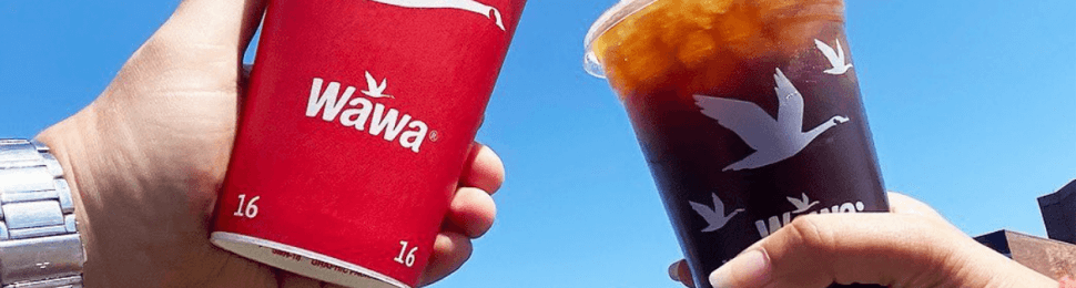 two wawa coffees "cheers"ing