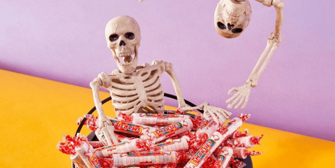 Skeletons hang out in bowl of smarties