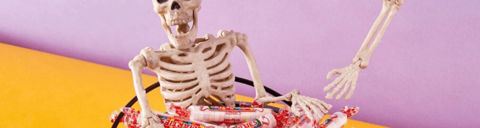 Skeletons hang out in bowl of smarties