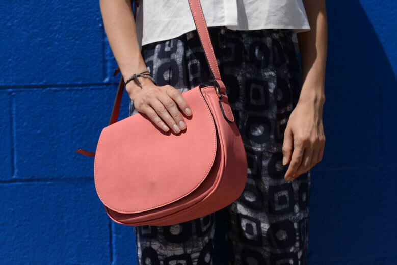 Person holding pink leather pink