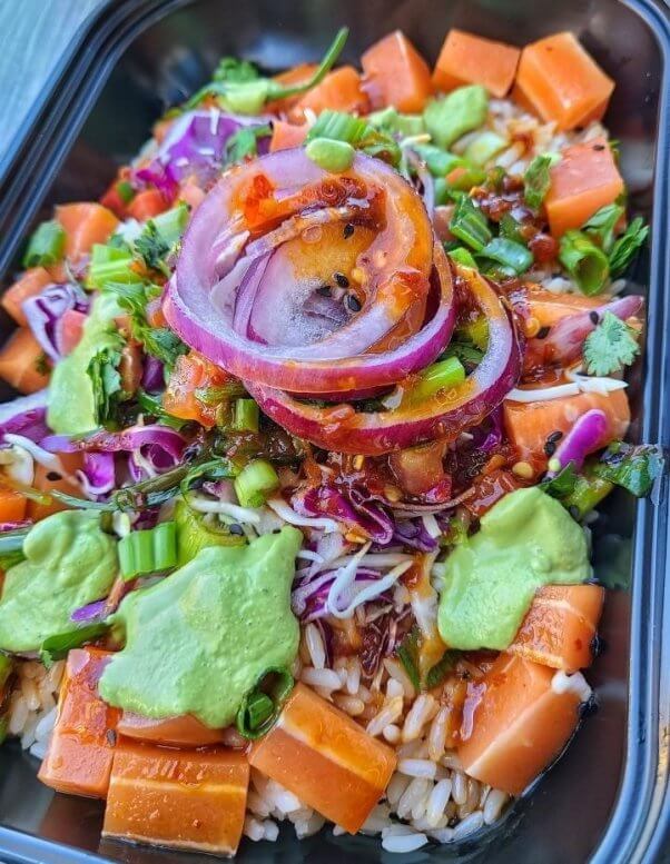 California Fish Grill's "Ahi" Poke Bowl, served with rice, onions and avocado