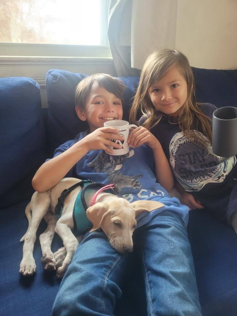 Rescued puppy Carmen with her new family