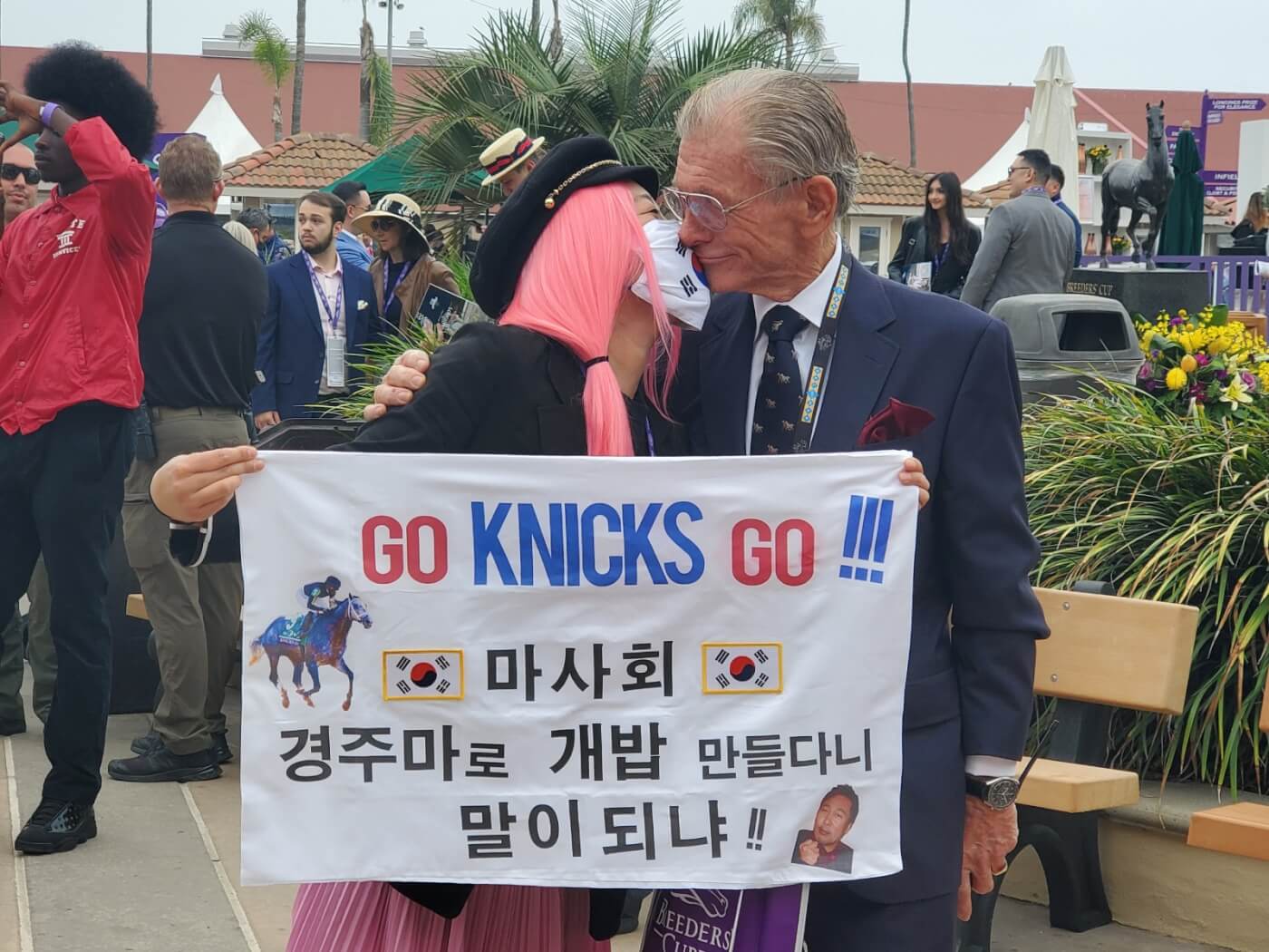 woman holding sign with Joe Harper