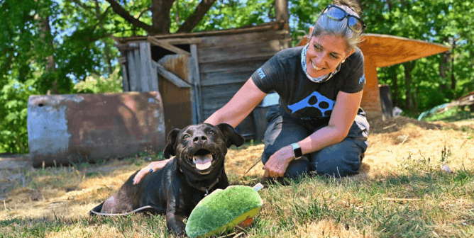 Daphna with dog in field