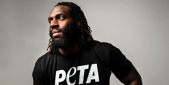 Matt Judon posing in PETA tshirt