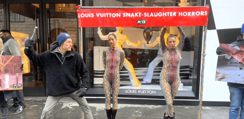 ‘Bloody Snakes’ Hang From Hooks Outside Louis Vuitton