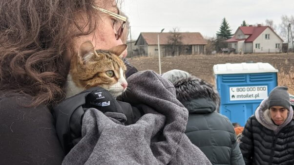 Woman holds cat