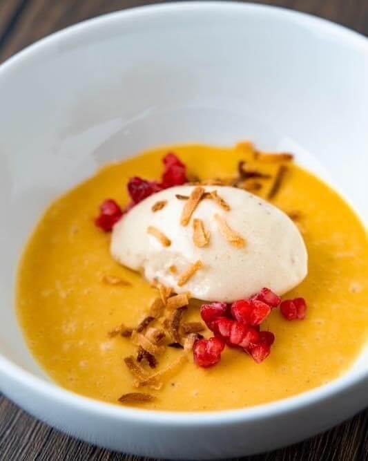 passionfruit pana cotta toped with banana and coconut milk ice cream