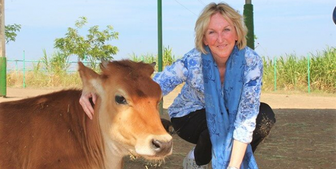Ingrid Newkirk with cow