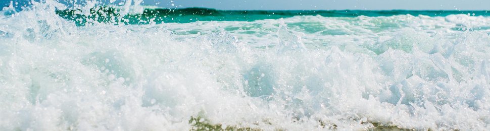 beach waves crash on sand