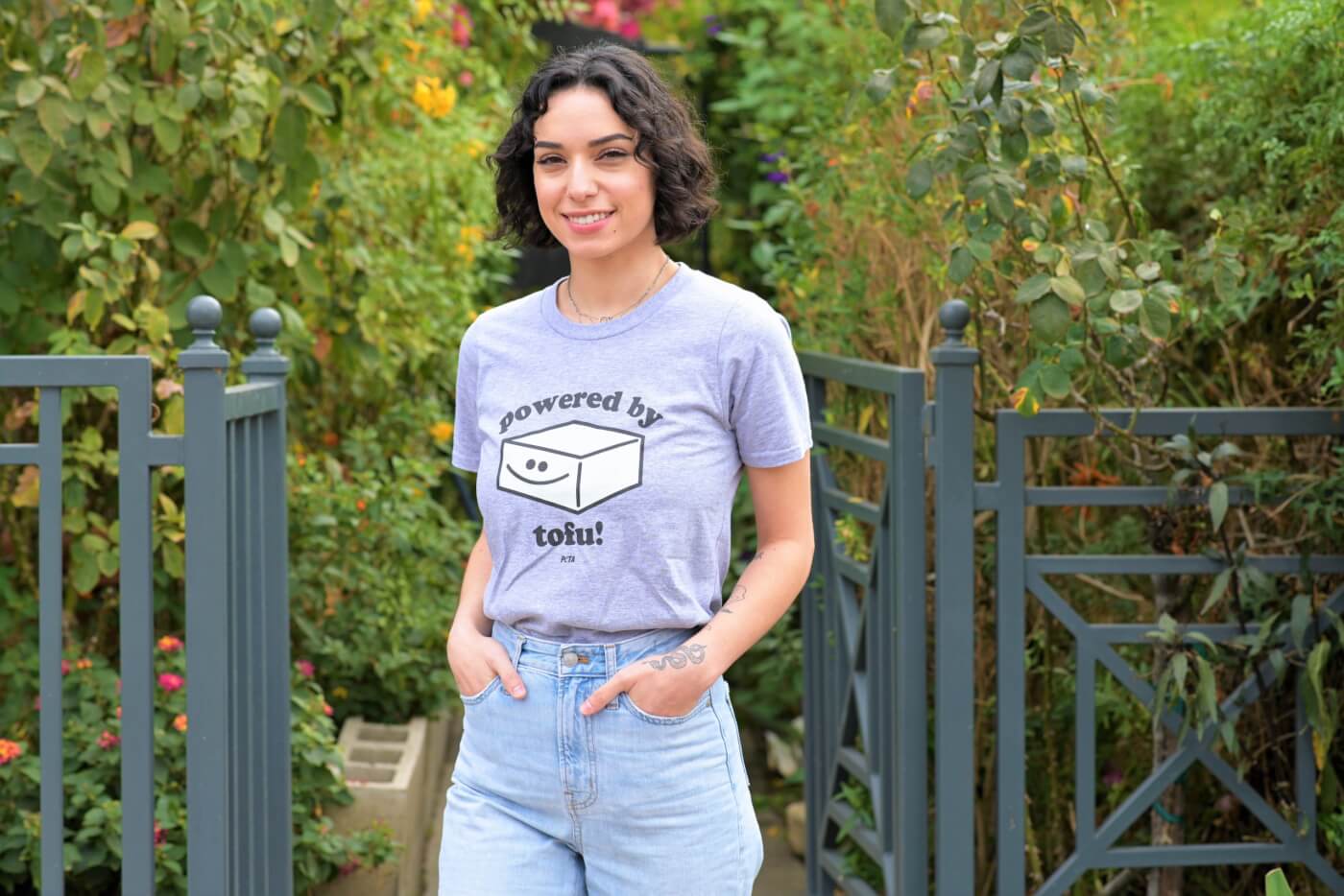Model wearing powered by tofu tee