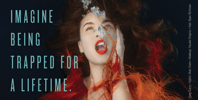 Ad with Rainey Qualley underwater with the text "Imagine being trapped for a lifetime. Boycott SeaWorld."