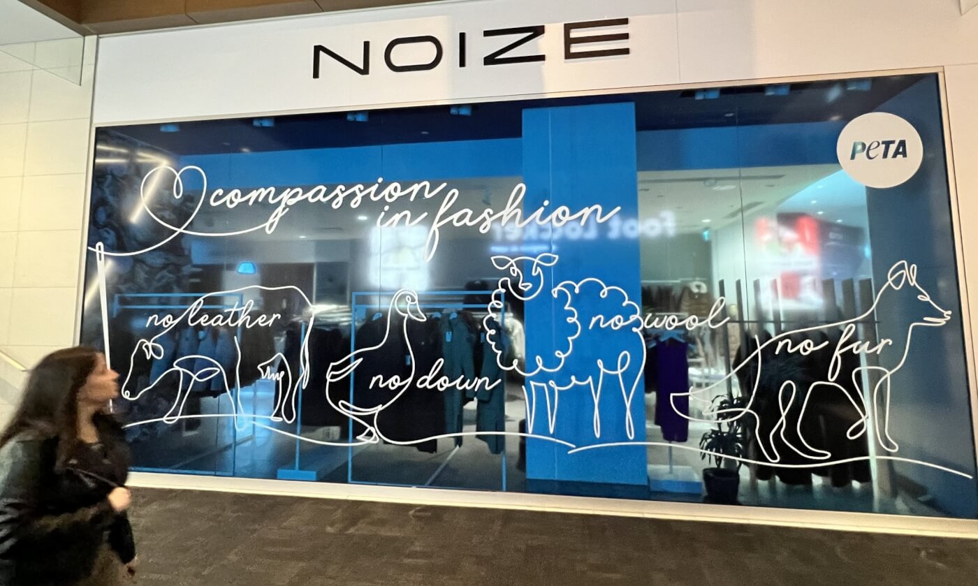 noize window display featuring illustrations of animals used for clothing