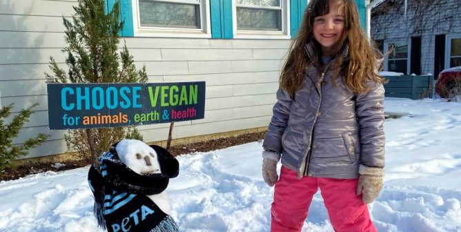 little kid wearing vegan winter wear out in the snow