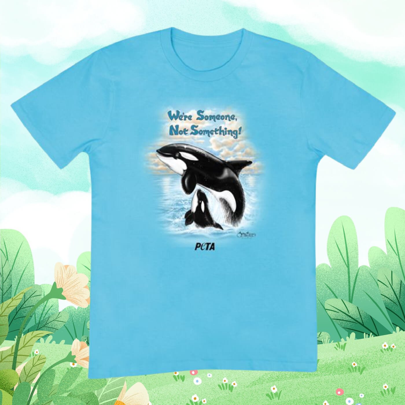 Betsy Baytos orca design on a blue tee