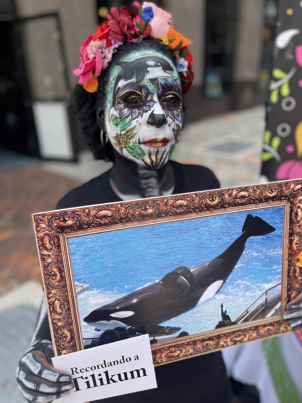 protester holding picture of whale