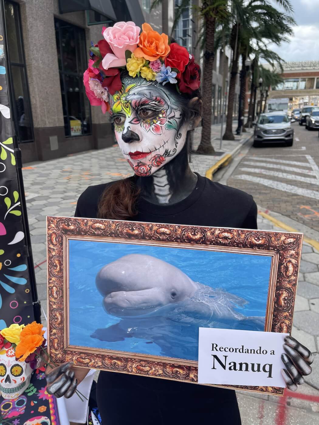 protester holding picture of beluga