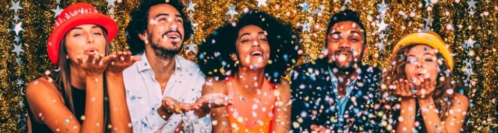 new year party of five people celebrating with confetti