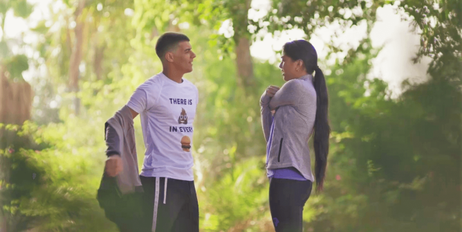 woman and man at a park in never go vegan ad