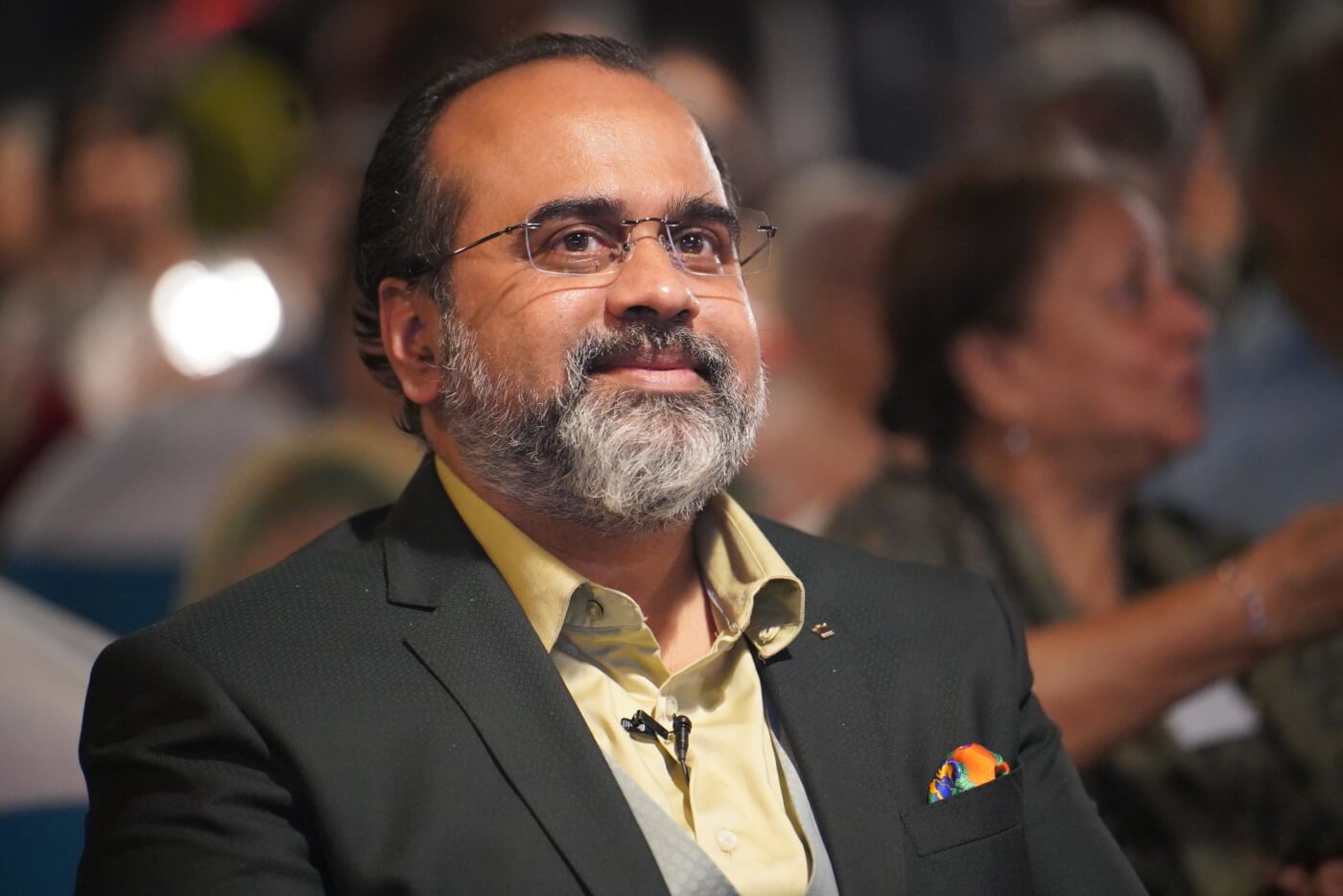 Close-up on Acharya Prashant smiling at PETA India award ceremony where he was named 2022