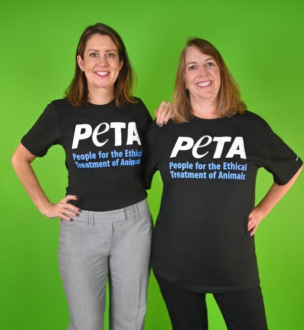Fur Fights to Finance: Meet PETA Foundation Employees PETA Foundation Employees Amber and Kelly in PETA shirts with green background