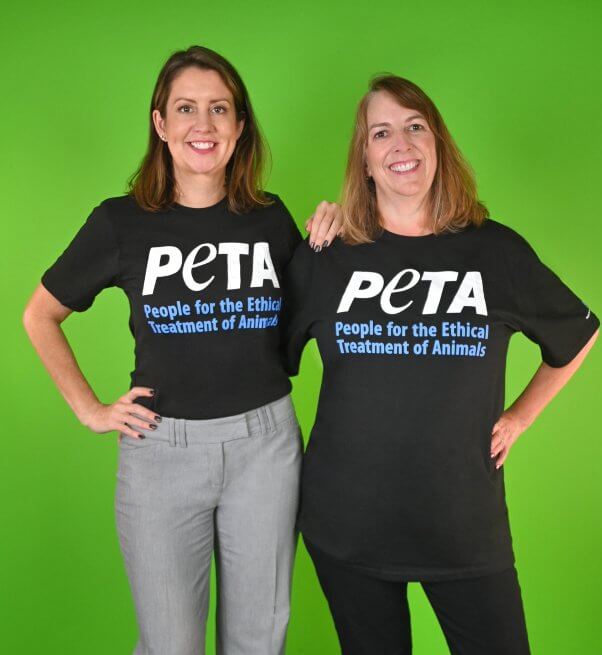 PETA Foundation Employees Amber and Kelly in PETA shirts with green background