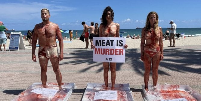 protesters painted to look like raw meat