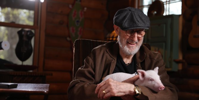 James Cromwell with rescued pig Babe inside