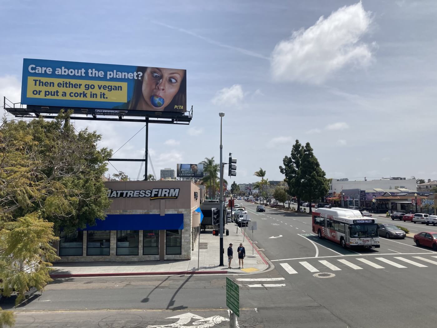 PETA's 2023 Earth Day ad on a billboard above an intersection in San Diego, California