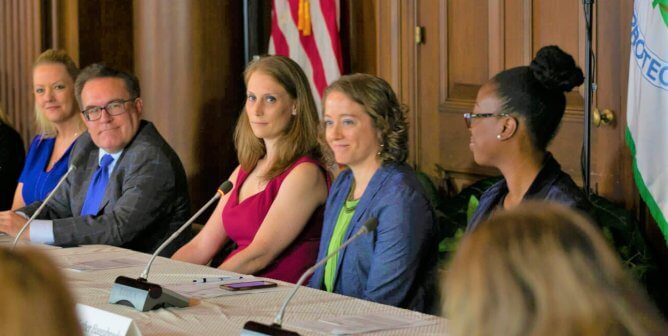 Group of people talking at conference