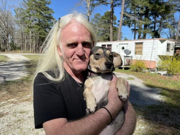 dog spayed by PETA poses with her guardian