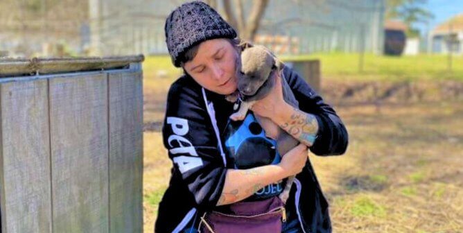 CAP worker with small puppy