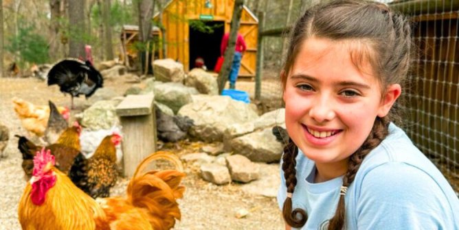 Dani with chickens for PETA Kids feature