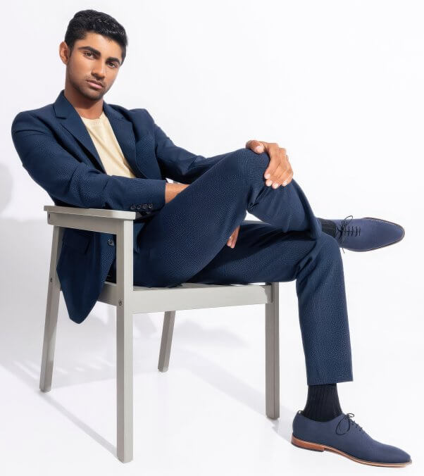 A model wearing Ethik brand's vegan oxford shoes