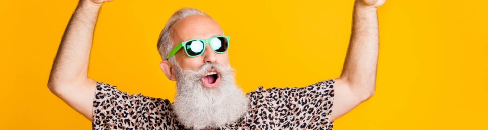 Photo of dancing cheerful rejoicing cool old man feeling young dancing in front of yellow vivid background he is isolated over