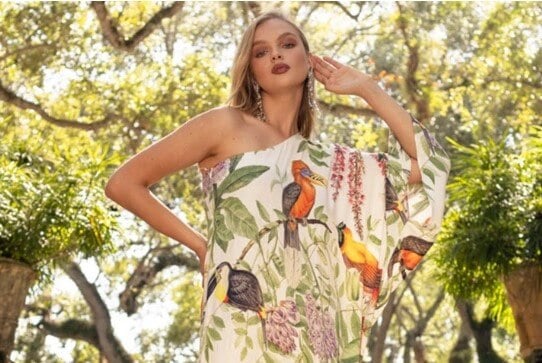A model wears a vegan silk dress