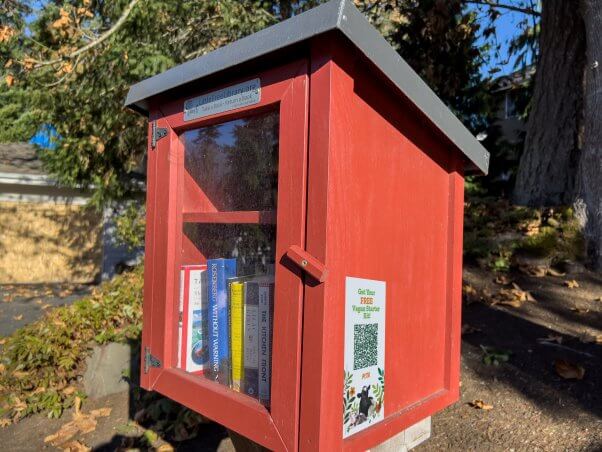 A PETA VSK QR code sticker on a Little Free Library