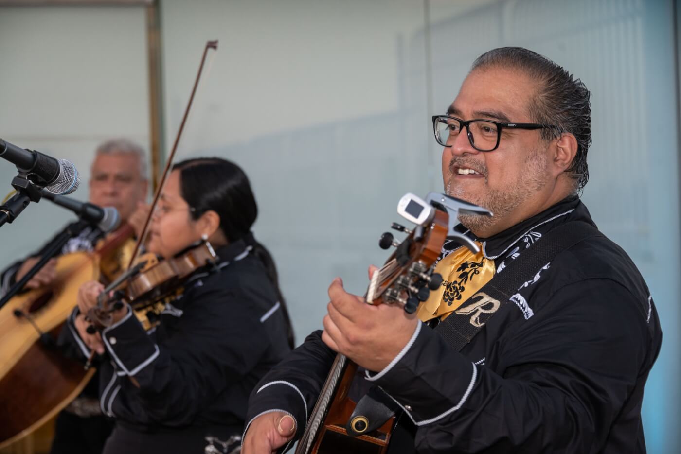 Rodrigo Rodriguez Diaz and his Mariachi Romanza playing instruments at PETA Latino's tenth anniversary party