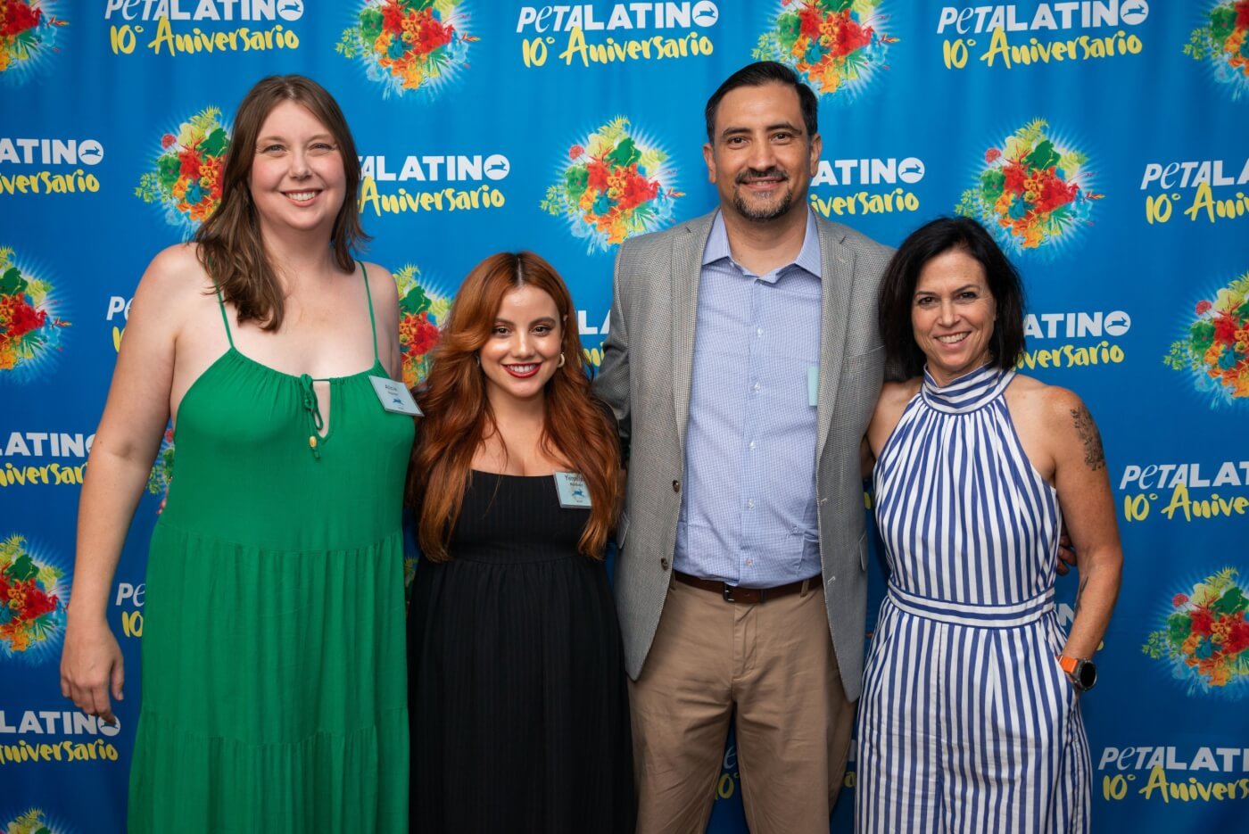 Alicia Aguayo, Yennifer Martinez, Gabriel Ochoa, and Lisa Lange in front of PETA Latino's tenth anniversary banner