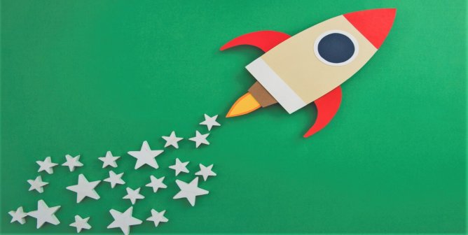 rocket blasting off with trail of stars on green background