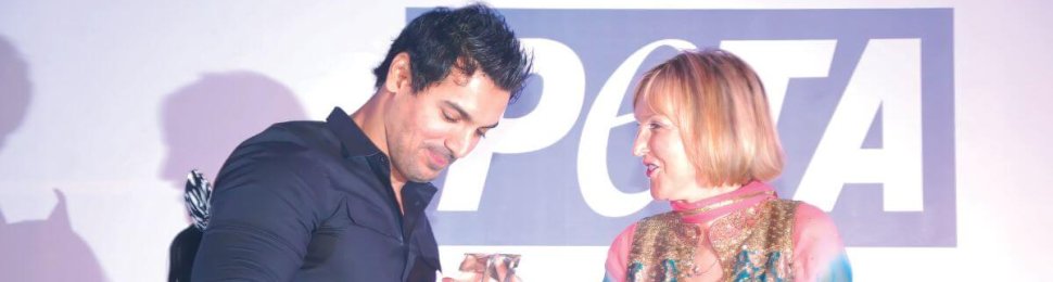 Ingrid gives John Abraham an award